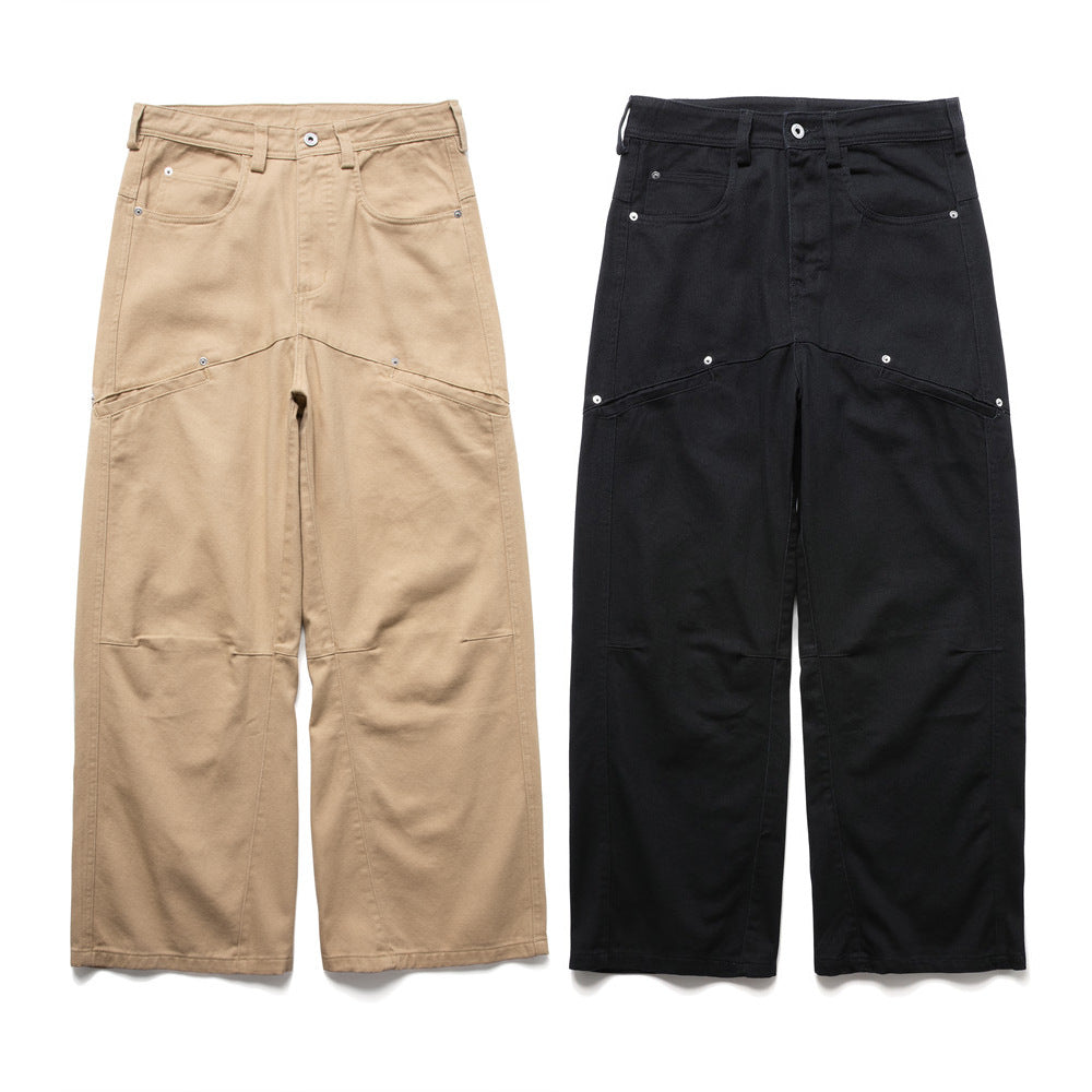 Baggy-Cargohose für Herren mit weitem Bein und mehrteiliger Gestaltung in Schwarz und Khaki, Nietenbeschlägen und Workwear-Teilungsnähten