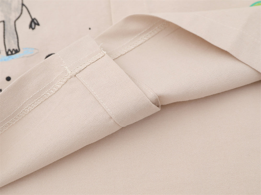 Close-up of sleeve hem stitching on beige woven shirt fabric