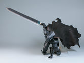 The Berserk Brand Marked Guts Berserker Armor Action Figure, a fully poseable 16 cm PVC statue with black armor and large sword, is reminiscent of the iconic character and perfectly posed in a kneeling position. A must-have for any dedicated Berserk fan.