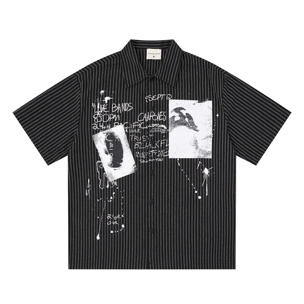 Men's oversized black pinstripe short-sleeve button-up shirt with abstract graffiti and ink-splash graphic print on the front