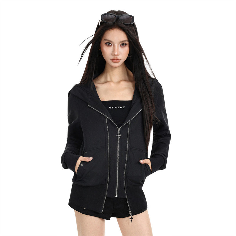 Black zip-up hoodie jacket worn open on a model with hands in pockets