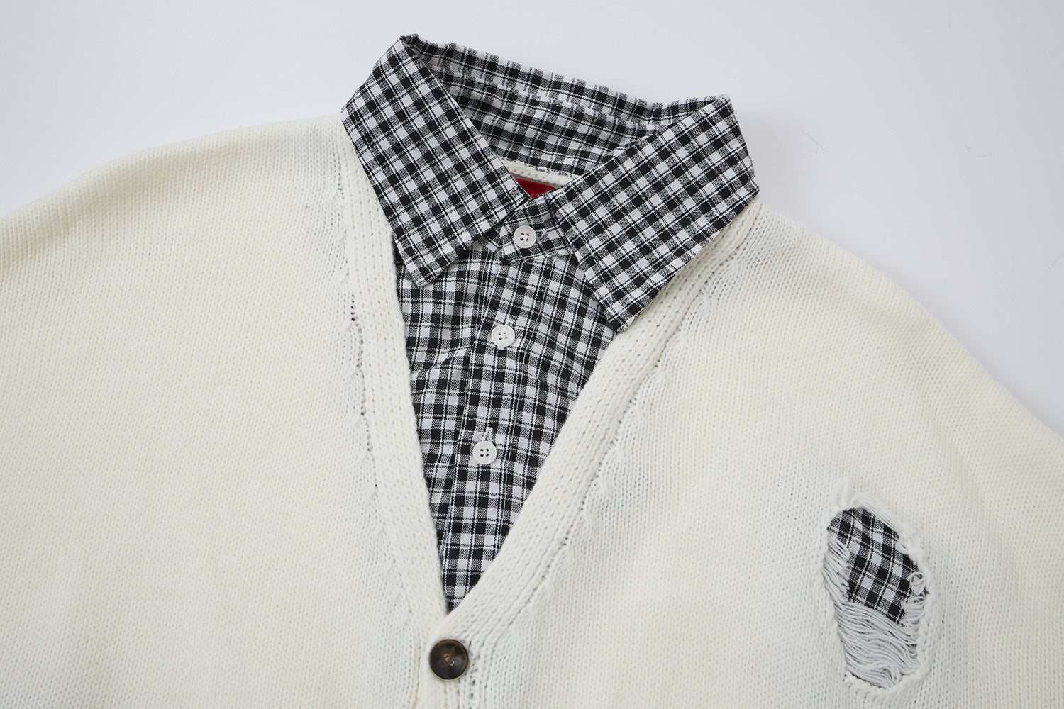 Cardigan en maille déstructurée à col tartan superposé