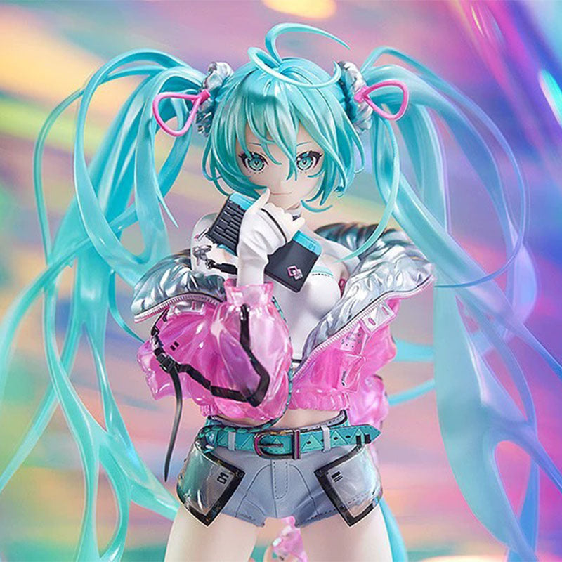 The Hatsune Miku 24cm PVC Figure features the iconic Vocaloid with long turquoise twin tails and pink bows, dressed in a silver and pink jacket, gray shorts, and a white top. She holds a microphone against an iridescent background. This collectible comes in a branded box.