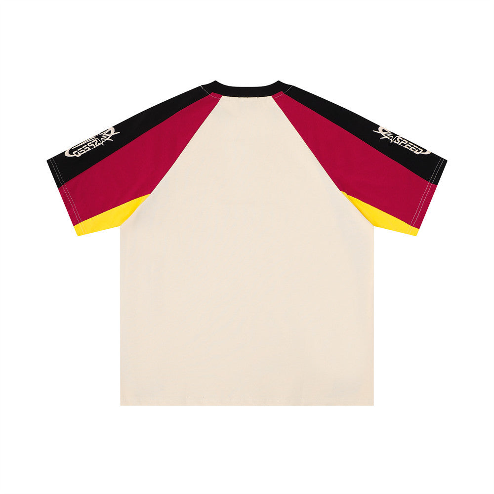 Back view of cream colorblock tee with black shoulders, red sleeves, and yellow accents