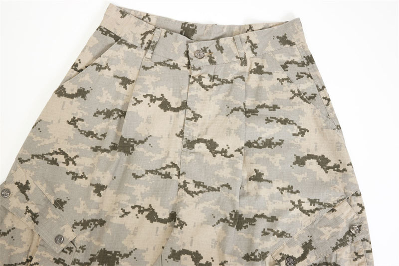 Close-up of desert camo pants waistband and pleated front detail