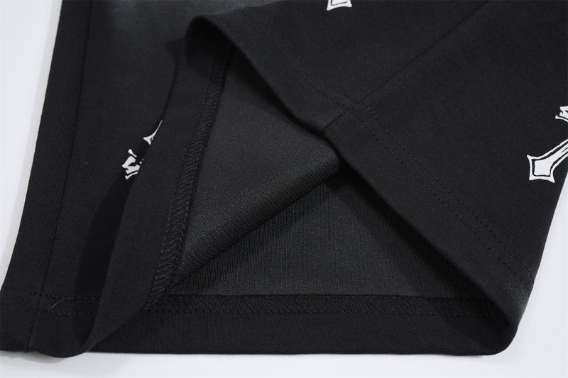 Pantalon de survêtement à jambes larges avec croix gothique et finition délavée