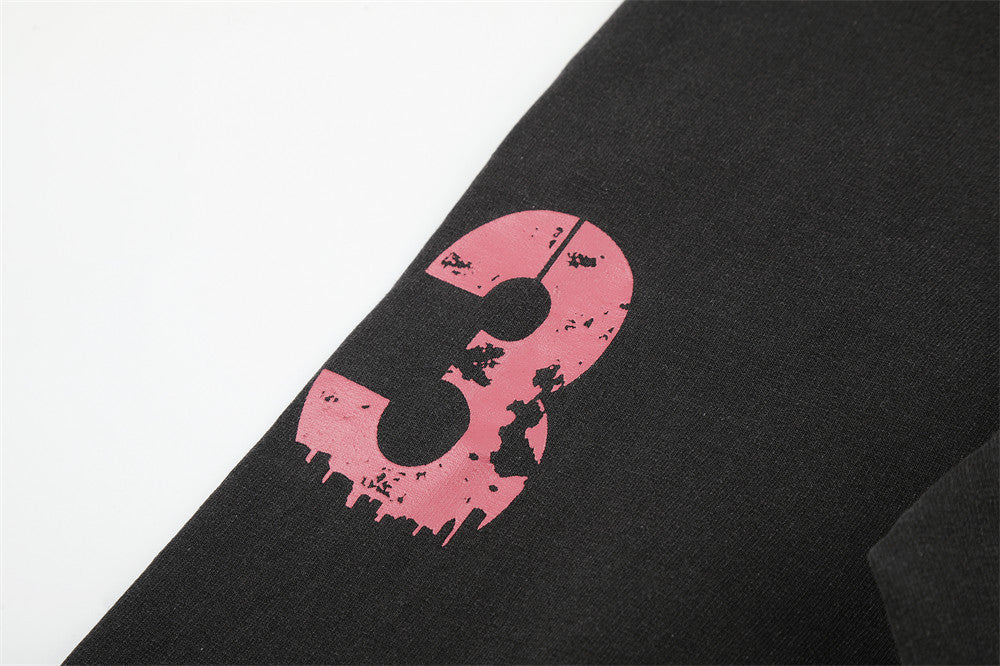 Pink distressed number 3 printed on black long sleeve sleeve