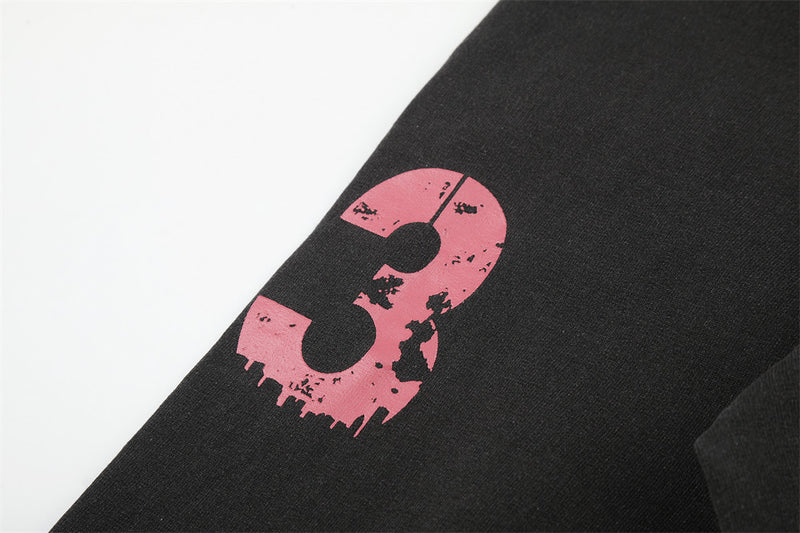 Pink distressed number 3 printed on black long sleeve sleeve