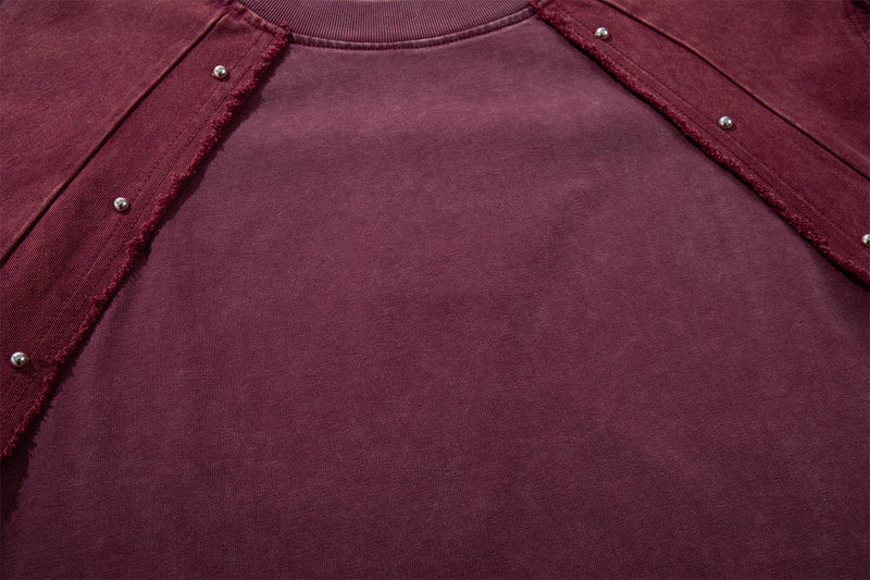 T-shirt patchwork raglan délavé à l’acide, coutures à bords bruts et détails rivetés