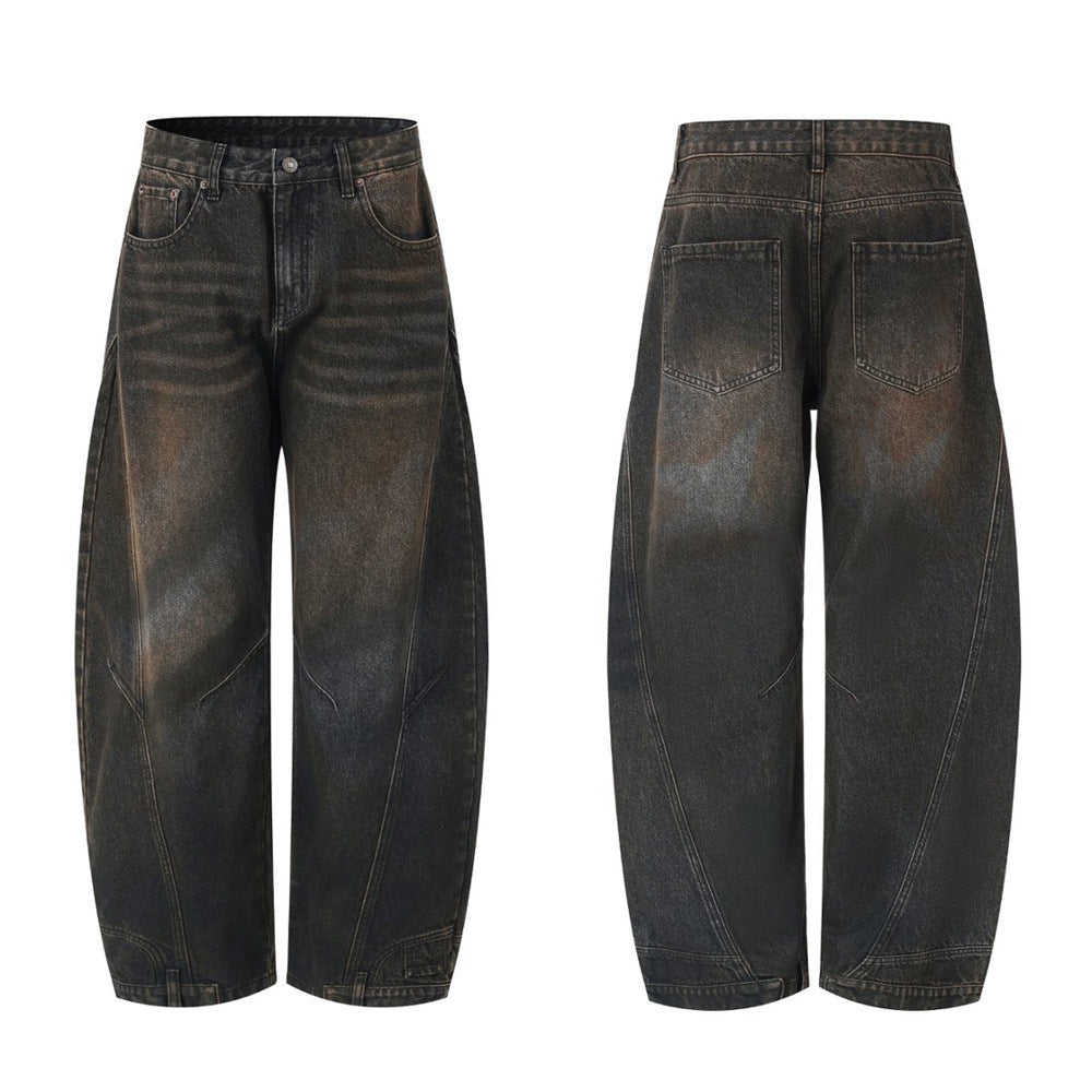 Men's baggy barrel-leg distressed jeans with curved seam detailing shown in washed black colorway, front and back view