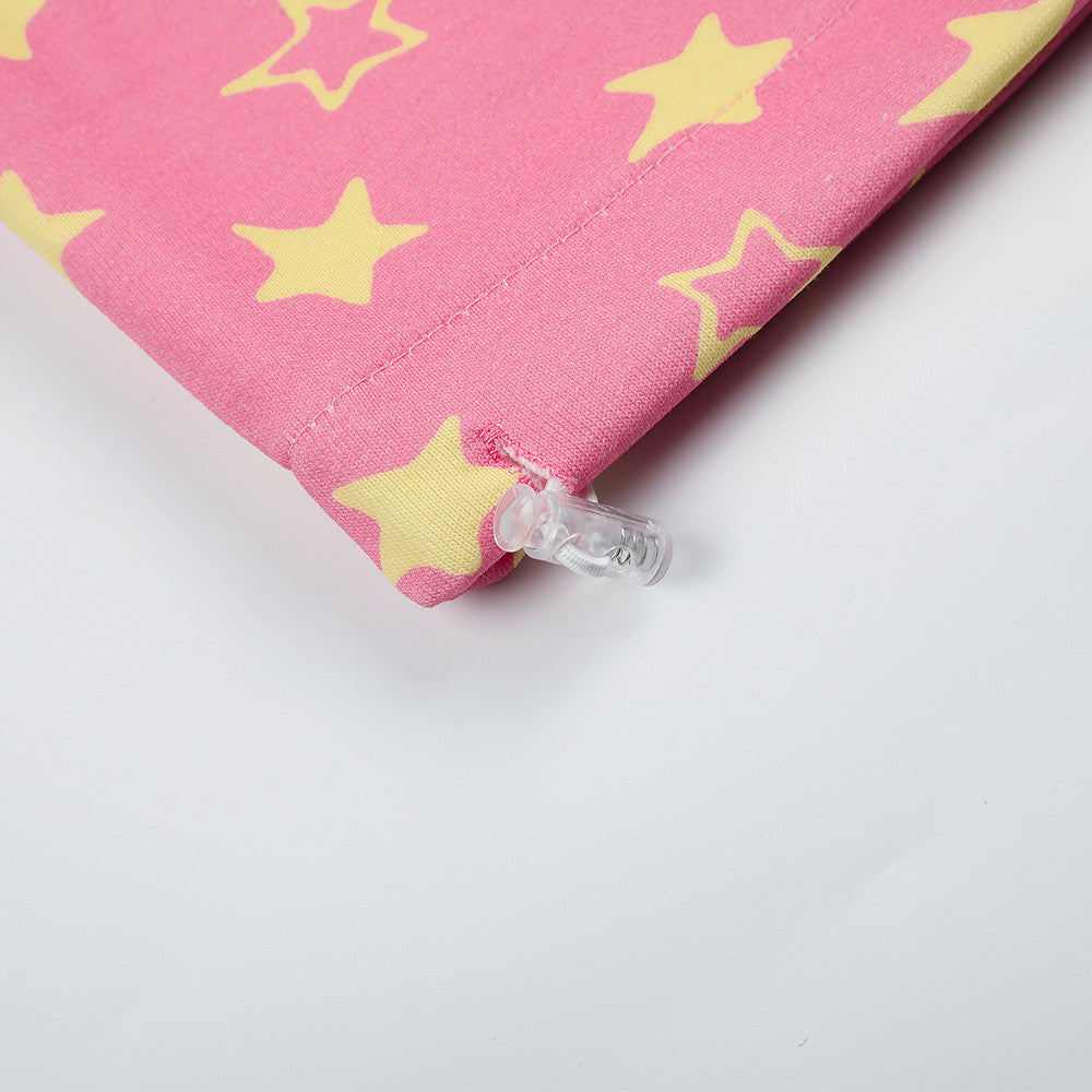Close-up of pink star print sweatpants hem and adjustable toggle