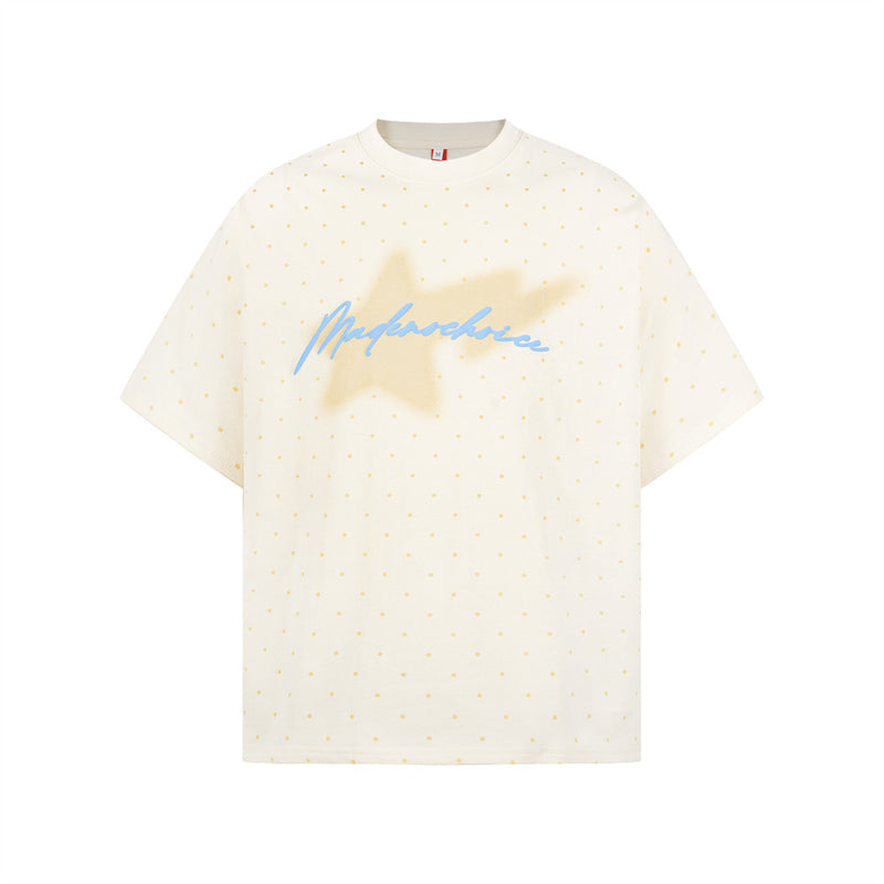 Oversized cream polka dot t-shirt with blurred star and blue cursive script graphic on chest, streetwear style