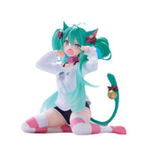 The Kneeling Cat-Ear Hatsune Miku 11cm PVC figure by Hatsune Miku showcases the teal-haired character with cat ears and tail, wearing a white sweater, striped knee-high socks, pink collar with bell, and an animated expression while sitting on the floor.