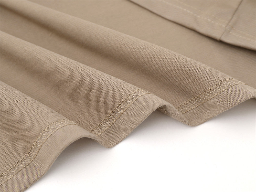 Close-up of khaki sleeve cuffs with stitched hem detail
