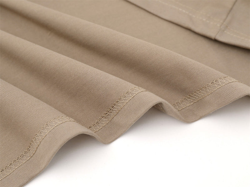 Close-up of khaki sleeve cuffs with stitched hem detail