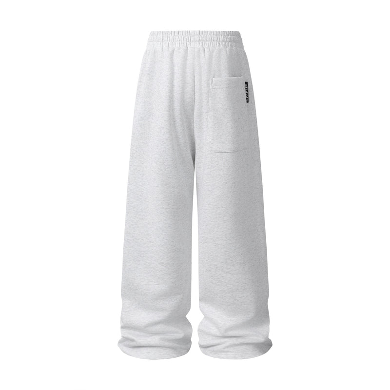 Pantalon de survêtement à jambes larges avec passepoil contrastant et écusson brodé