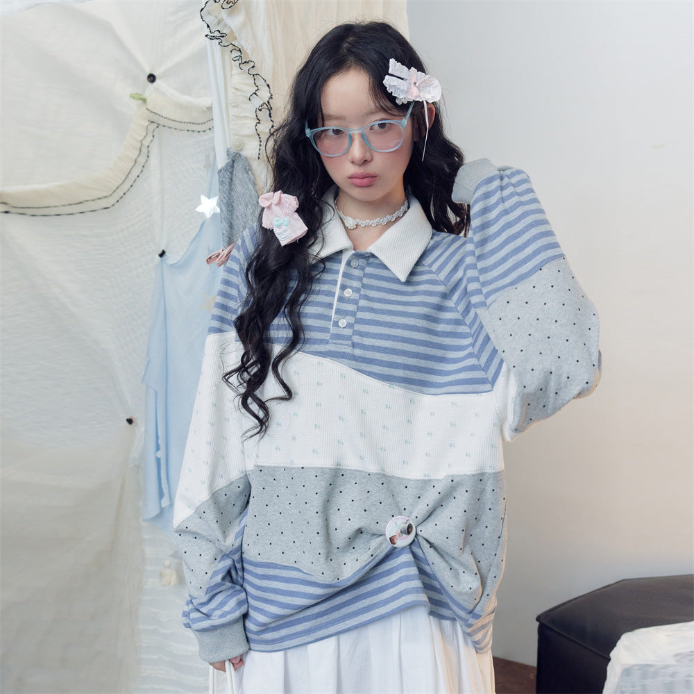 Oversized patchwork long-sleeve polo shirt with blue and white stripes, cream jacquard, and grey polka-dot color-block panels