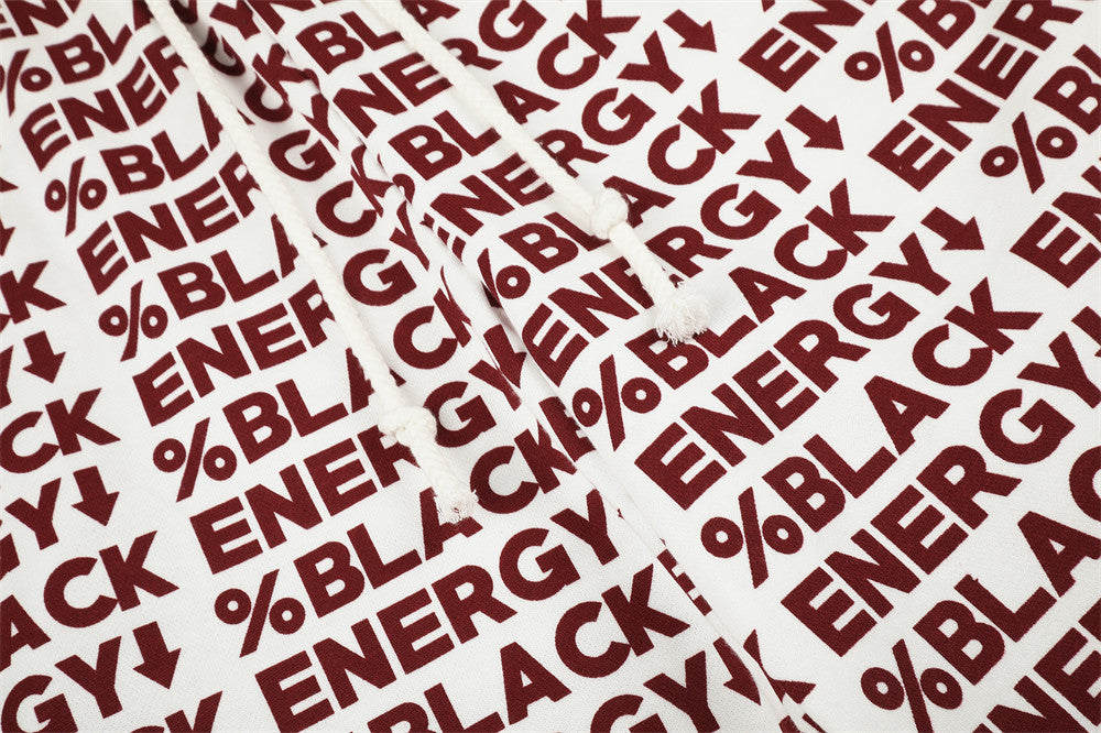 Close-up of white drawstring waistband with red BLACK ENERGY print and braided ties