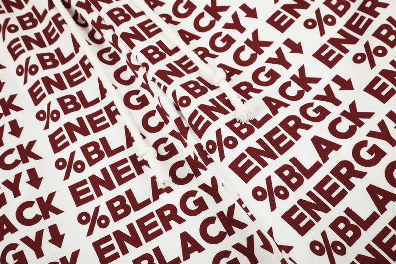 Close-up of white drawstring waistband with red BLACK ENERGY print and braided ties
