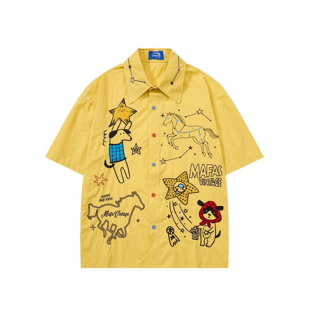 Yellow oversized short sleeve button-up shirt with cartoon dog, star constellation, and horse embroidery by Mafas Vintage