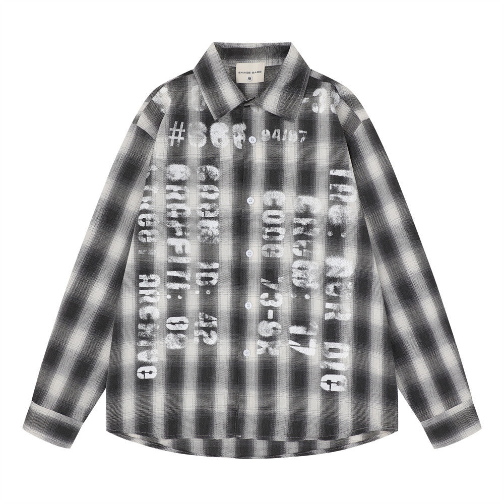 Oversized plaid flannel long sleeve shirt with distressed graphic letter print on the front, shown in charcoal black colorway