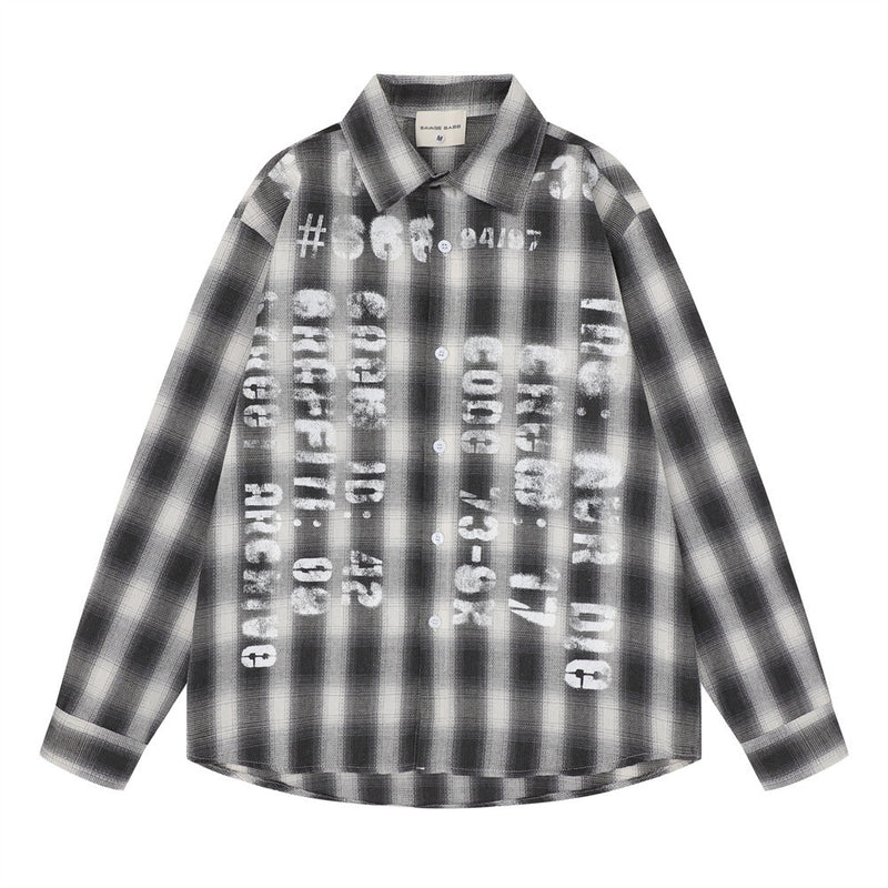 Oversized plaid flannel long sleeve shirt with distressed graphic letter print on the front, shown in charcoal black colorway