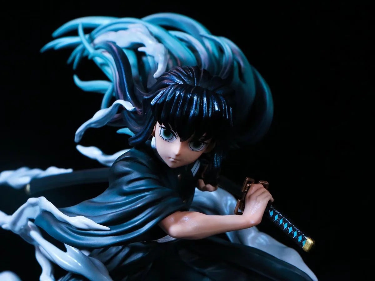 The Muichiro Tokito Demon Slayer Figure is a premium 18cm PVC collectible featuring the Mist Hashira with a dynamic mist effect. His long blue-black hair, serious expression, dual-wielded sword, and dark robe make it an essential piece for Demon Slayer fans.