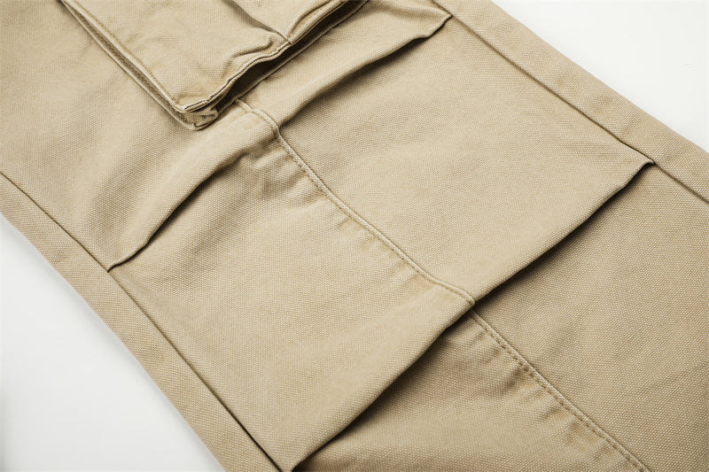 Close-up of beige cargo pants layered knee panel and stitched seam