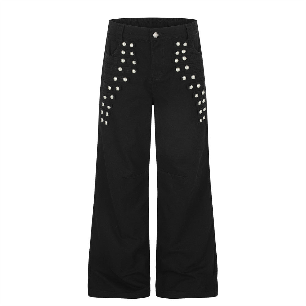 Pantalon homme noir à jambes larges, orné de perles et de clous métalliques argentés sur le devant des cuisses