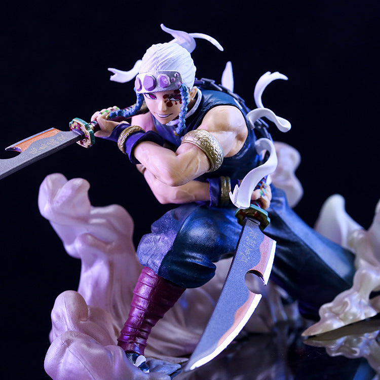 The Uzui Tengen Action Figure by Demon Slayer, at 14CM, showcases the Sound Hashira in a dynamic pose: crouching with white hair and headband, dual swords drawn, dark attire with gold accents and swirling ribbon elements.