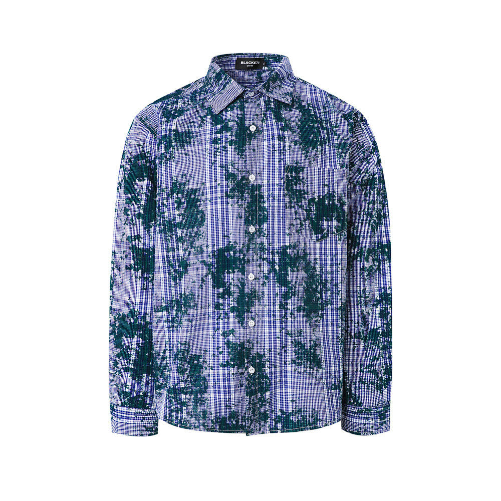 Oversized distressed plaid long sleeve shirt with dark green splatter print on blue check fabric, front view