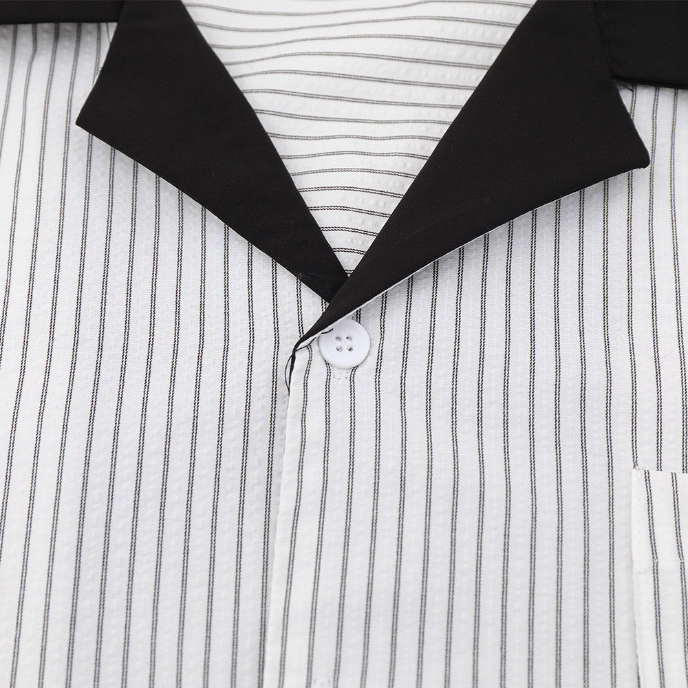 Close-up of black collar and top button on white striped long sleeve shirt