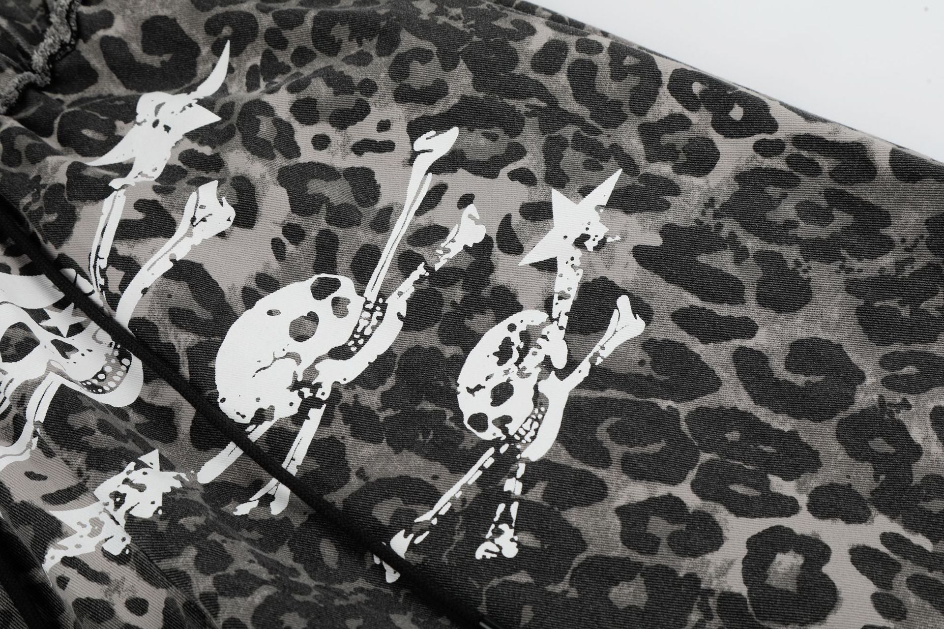 Wide-Leg Leopard Print Pants with Skull & Crossbones Graphic