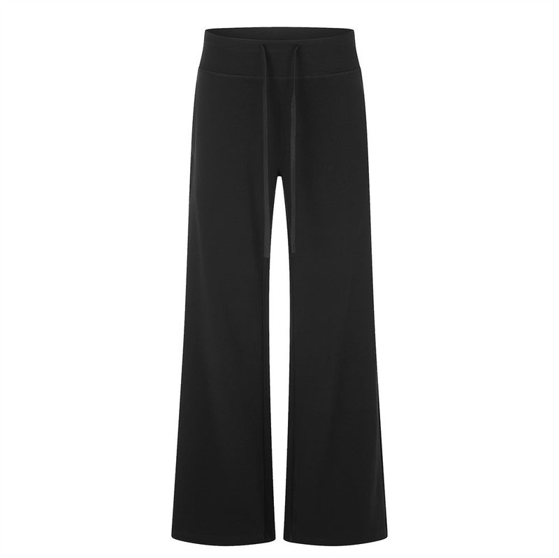Pantalon de survêtement homme noir à jambes larges et évasées, avec taille haute élastiquée à cordon et bas de jambe évasé