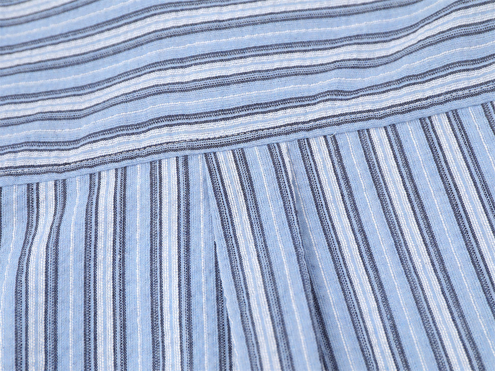 Blue striped shirt back hem close-up with yoke seam