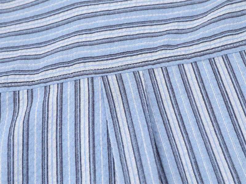 Blue striped shirt back hem close-up with yoke seam