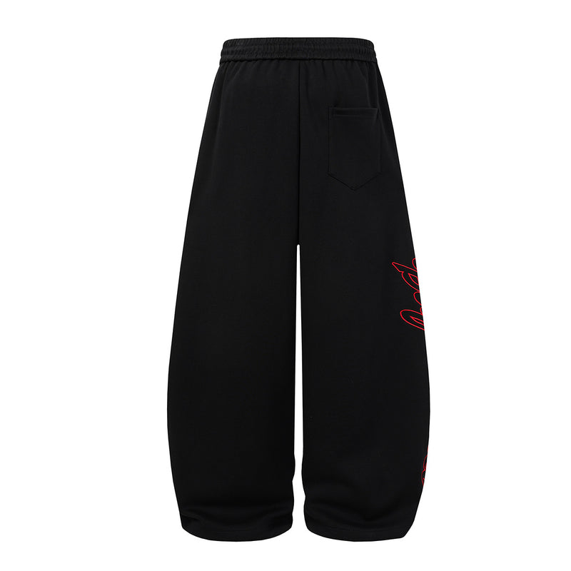 Baggy-Sweatpants mit weitem Bein – Camo- und schwarze Streetwear-Jogger mit Grafikprint