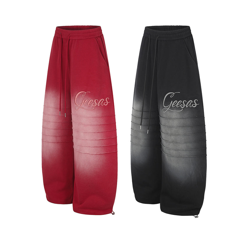 Pantalon de survêtement à jambes larges avec délavage dégradé et plis aux genoux