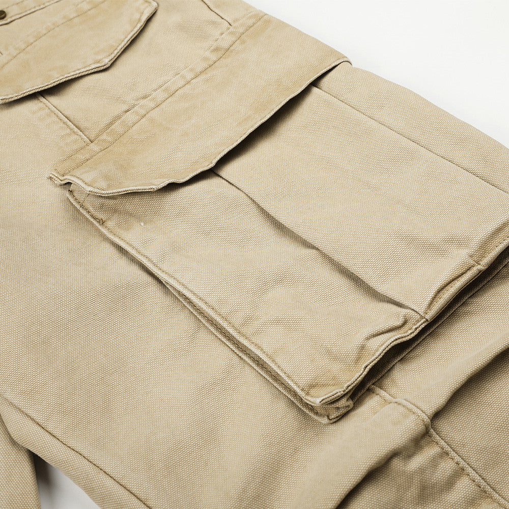 Close-up of beige cargo pants side cargo pocket and seam details