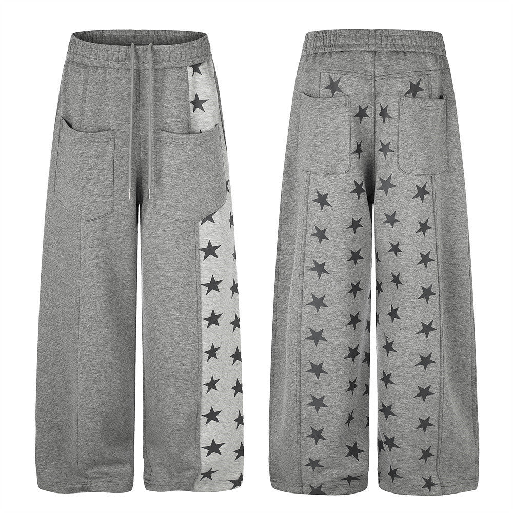 Pantalon de survêtement gris chiné à jambes larges, empiècement color-block imprimé étoiles et poches plaquées, vues de face et de dos