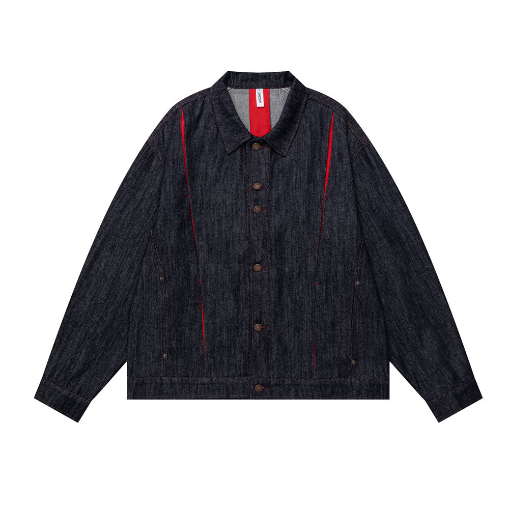 Men's dark indigo oversized denim jacket with red contrast center seam and antique brass snap buttons, front view