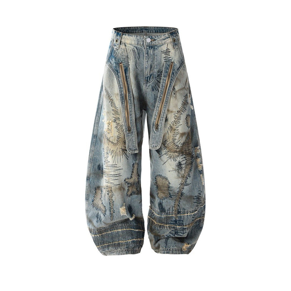 Baggy Wide-Leg Jeans – Chaotic Embroidery, Distressed Denim & Arc-Hem Design