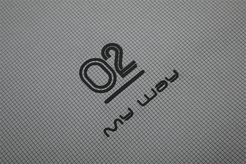 Close-up of gray shirt hem print with O2 logo and my way text