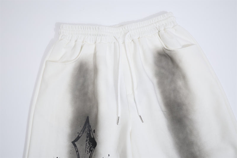 Pantalon de survêtement à jambes larges avec croix gothique et finition délavée