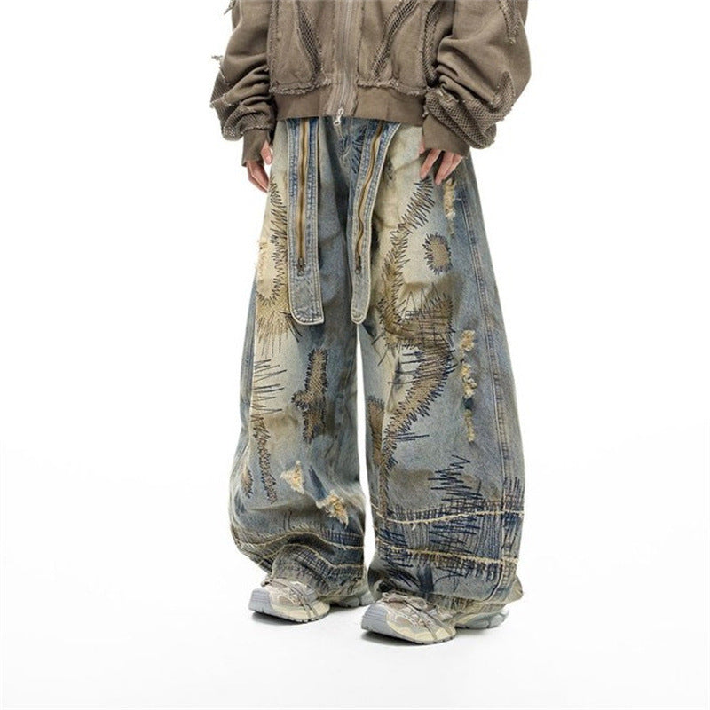 Baggy Wide-Leg Jeans – Chaotic Embroidery, Distressed Denim & Arc-Hem Design
