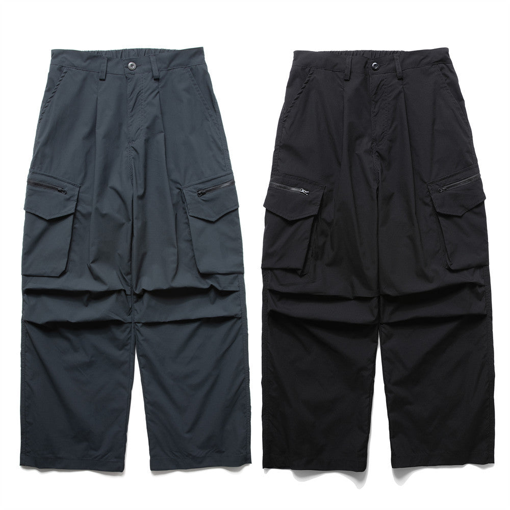 Wide-leg pleated cargo pants in charcoal grey and black with zip thigh pockets and elasticated waistband