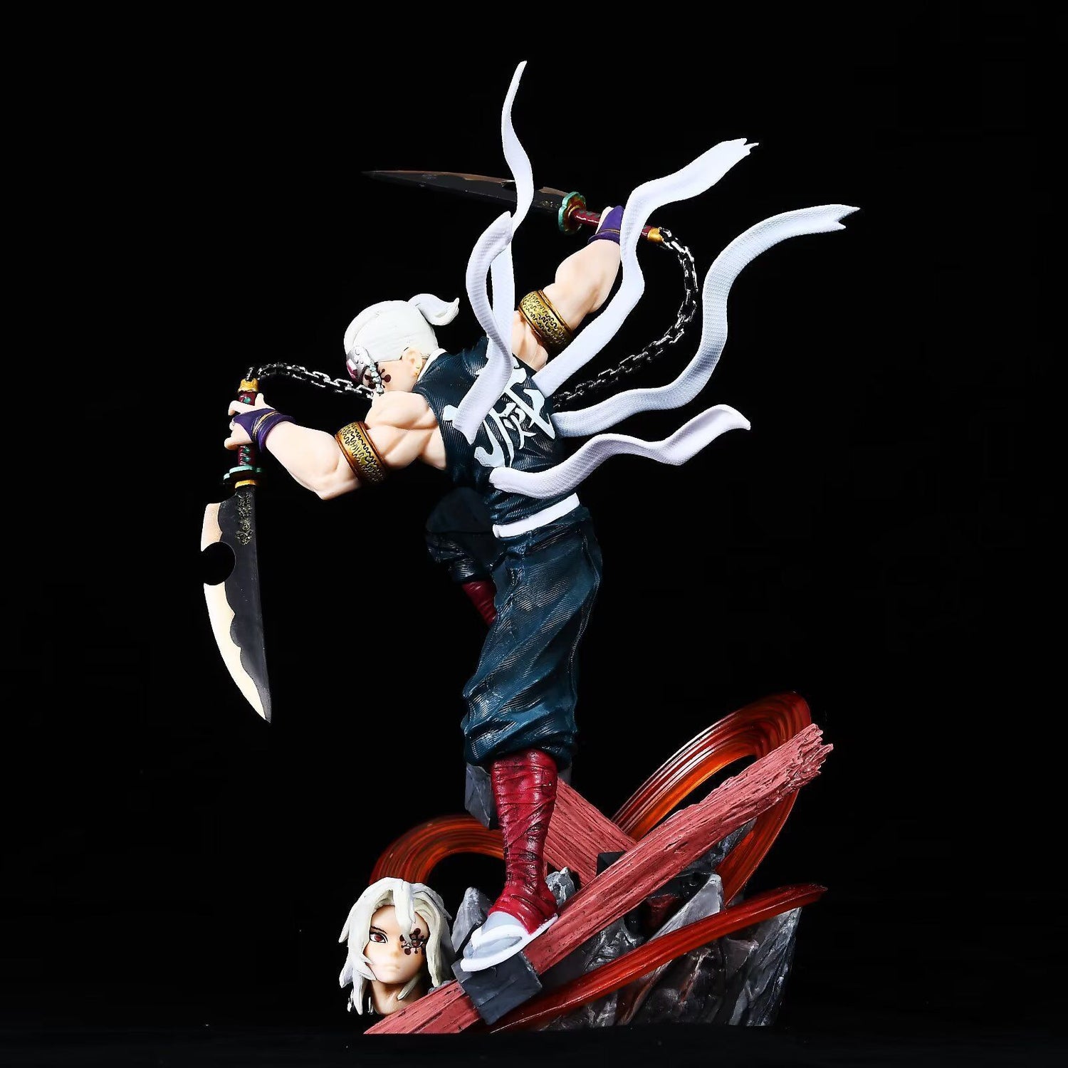 The Tengen Uzui Battle Sound Pillar Figure, a 27cm Demon Slayer collectible, features dynamic white-haired Uzui poised for battle with twin swords on a red and black base. Made from high-quality PVC, it includes ribbon-like details and an eagle head replacement.