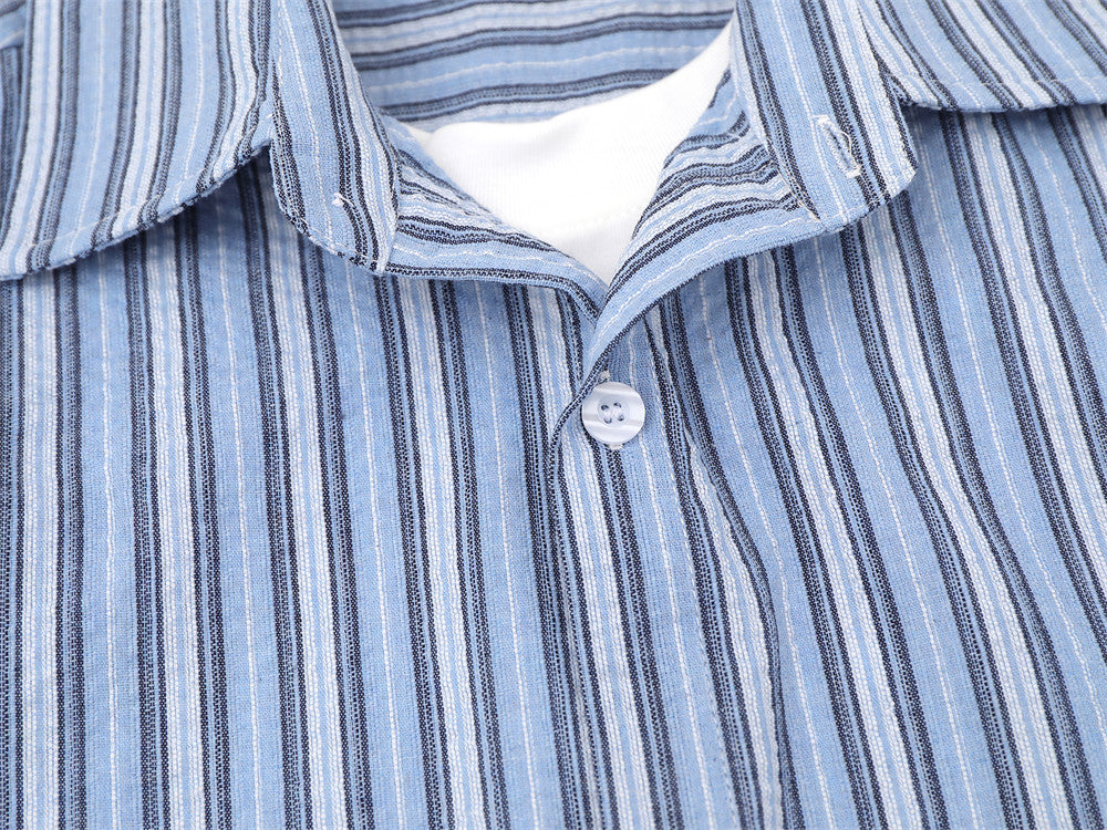 Blue striped shirt chest close-up with open collar and front button