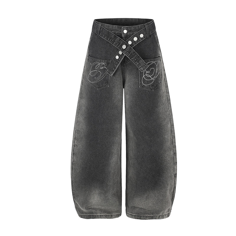 Vaqueros baggy de pierna ancha con cinturilla cruzada de broches y bolsillos bordados