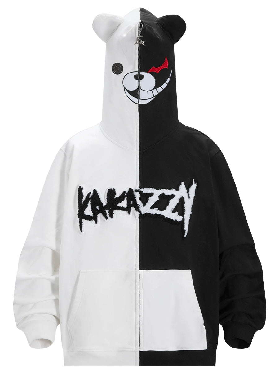 The Seakoff Monokuma-Inspired Hoodie is a must-have for Danganronpa fans, boasting a split black-and-white design, a stylized bear face on the hood, and &quot;KAKAZZY&quot; on the front. The asymmetrical mischievous bear expression adds an edgy flair.